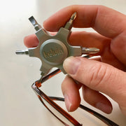 Kelvin 07 spinner tightening a pair of glasses