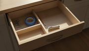 A tidy kitchen drawer with tape, a pencil and a flashlight